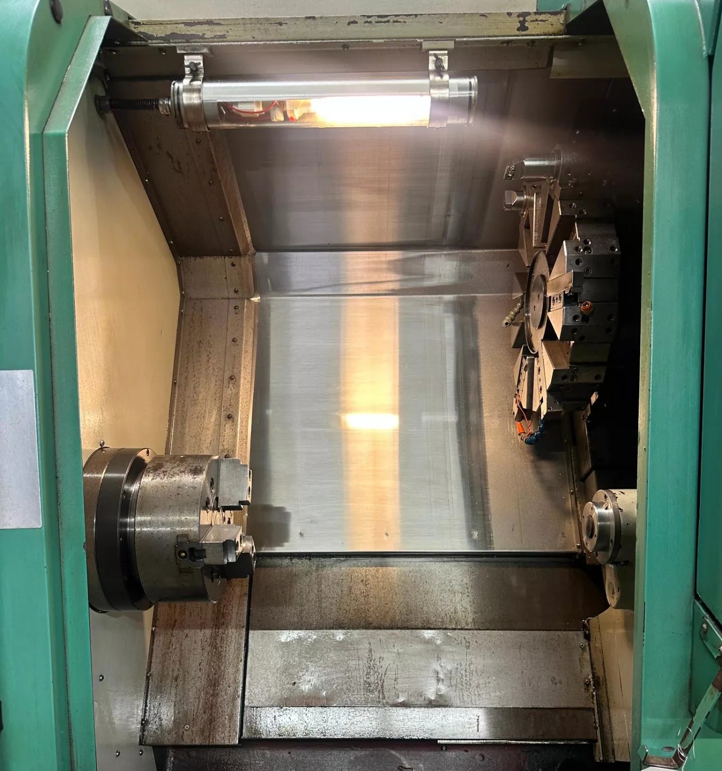 Used YANG ML-300 CNC Turning Center work area with 3-jaw chuck – SKU 50137
